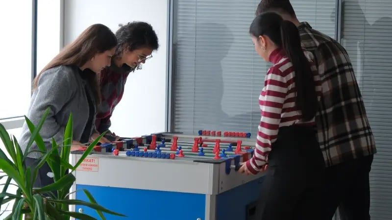 Webtures teammates playing table football